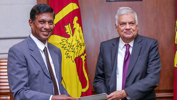 Retired Supreme Court Judge K.T. Chitrasiri with Sri Lanka President Ranil Wickremesinghe