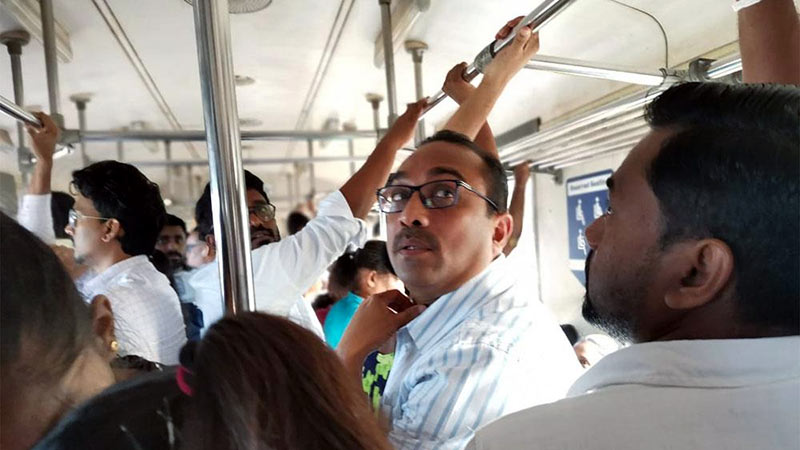 Sri Lanka's Transport Minister Bimal Rathnayake traveling on a train with passengers