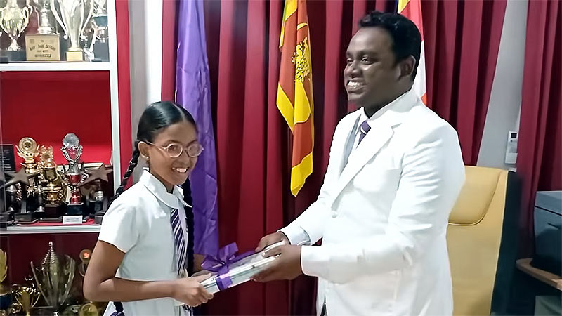 Bisadi Yevinya, the top scorer of the 2024 Scholarship Examination, honored by the Principal of Royal College, Horana